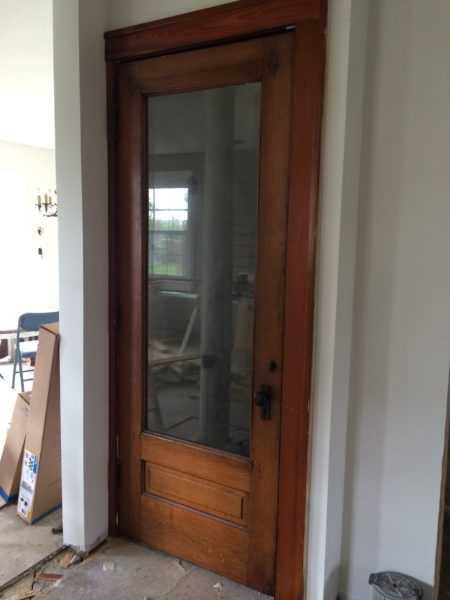 Basement door with faux antique mirror - House on Winchester