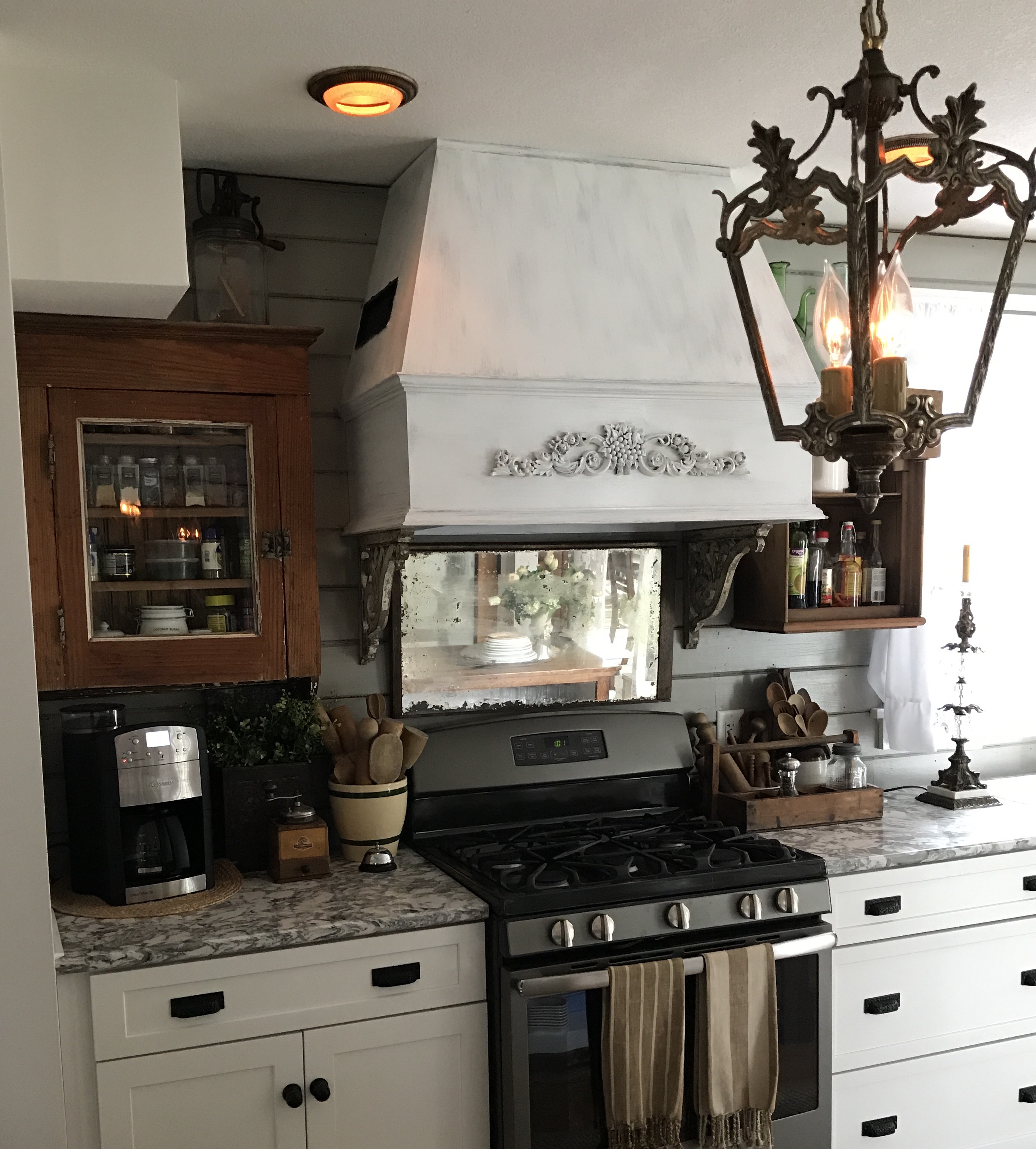 Large range hood and antique spice cabinet - House on Winchester