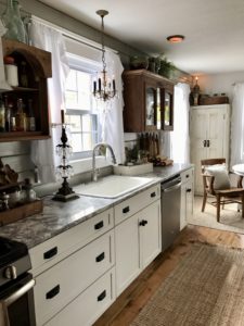 White shaker kitchen cabinets with random antique top cabinets - House on Winchester