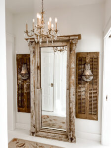 Mirror made from a church window, shutters, sconces
