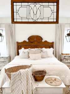 Leaded glass window above bed