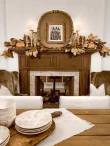 A Simple Fall Mantel with pumpkins