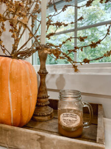 Decorating the Kitchen for Fall using berry stems and pumpkins.